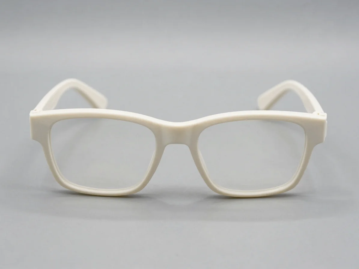 Straight-on product view of a plastic spectacle frame on a neutra